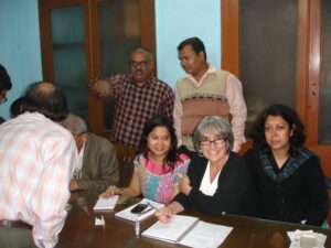 Joette Calabrese with Homeopathic doctors at the PBHRF Free night chambers (clinic) in Kolkata